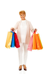 Happy business woman holging shopping bags