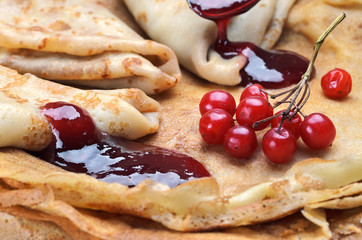 Tasty pancakes with jamand fresh berries
