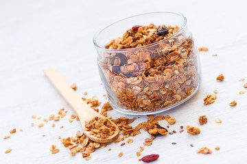 Freshly Granola in the bank on white background close-up, select