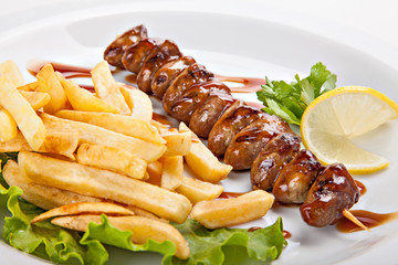 Plate of freshly prepared kebabs and fries
