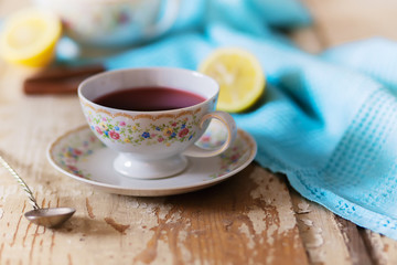 Cup of tea on wooden table. vintage scene.