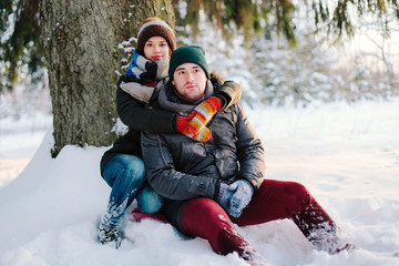 Beautiful couple in winter forest