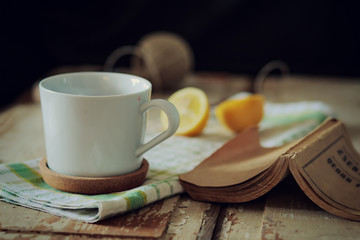 Cup of tea on wooden table. vintage scene.