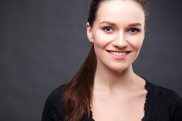 Close up portrait of elegant brunette woman with nude make up