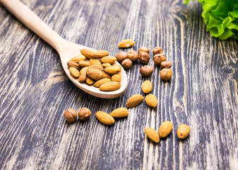 Almonds in wooden spoon 