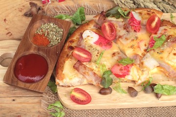 Italian pizza is delicious on wood background.