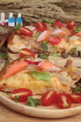 Italian pizza is delicious on wood background.
