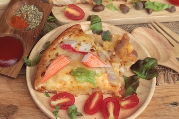 Italian pizza is delicious on wood background.