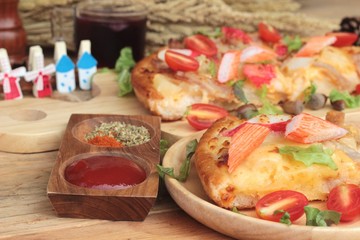 Italian pizza is delicious on wood background.
