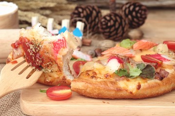 Italian pizza is delicious on wood background.