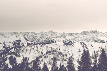 Fototapeta na wymiar Sunrise panorama of snow covered alpine mountains