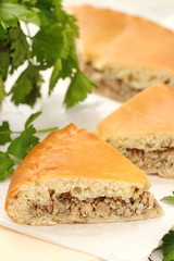 Traditional russian pie with meat and rice