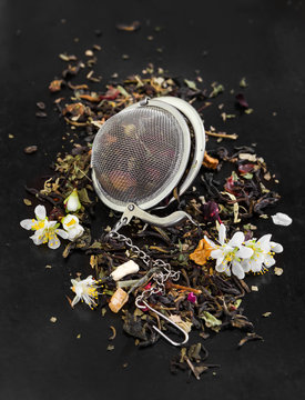 Herbal tea with flowers in tea strainer