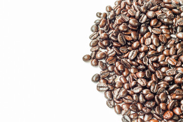 Brown roasted coffee beans on white background