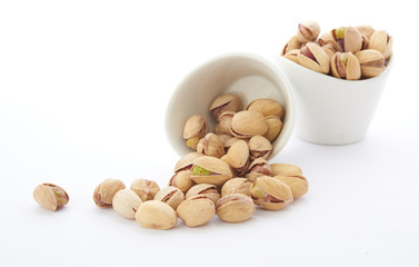 Heap of pistachios nuts isolated on the white