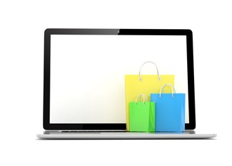 laptop and  shopping pags on white background