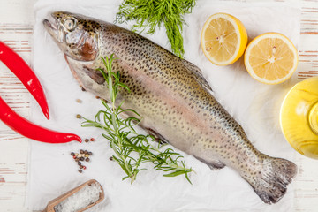 Fresh trout on white wood