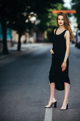 Fototapeta premium pretty girl posing in a city street