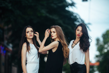 pretty girls posing in a city street