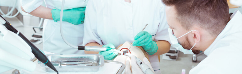 Students and dental treatment on phantom