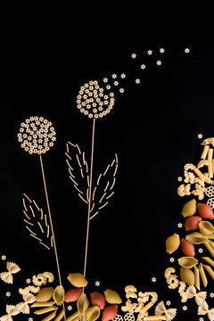 spaghetti in the form of dandelions on a dark background