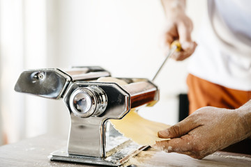 Man making ravioli, Italian cuisine and gluten-free - 104747472
