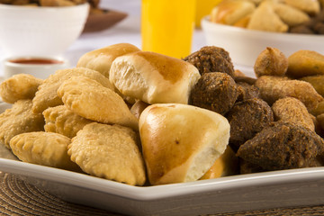 Mixed brazilian snack on the table.