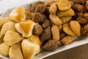 Mixed brazilian snack on the table.