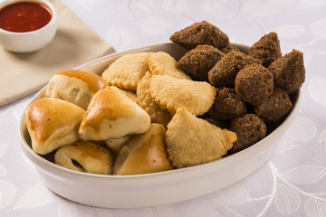 Mixed brazilian snack on the table.