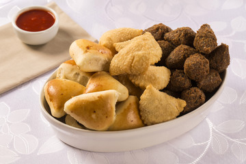 Mixed brazilian snack on the table.