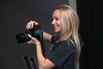female photographer taking pictures indoors