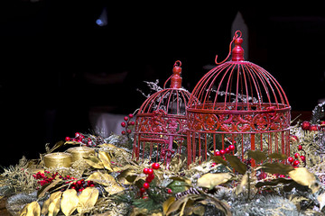 Decoration of the table in the restaurant. Ornamental birdcages