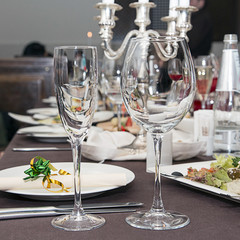 Beautifully decorated table in the restaurant. In the foreground