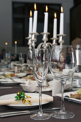 Beautifully decorated table in the restaurant. In the foreground