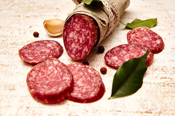 Salami on wooden background