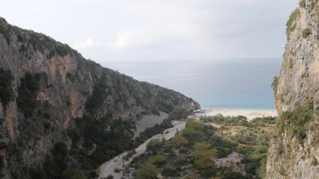 Aerial view rocky mountains cliff opening to the Adriatic sea
