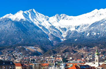 Fototapeta premium Austria, Tyrol, panoramic wiew over Innsbruck and Inn valley with the snowy mountains in the background