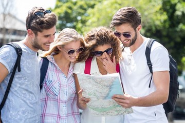 Fototapeta premium Hip friends checking map