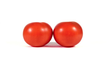 Two red tomatoes macro or close up isolated on white background