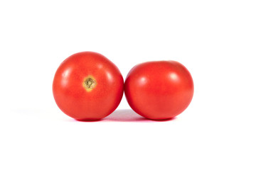 Two red tomatoes macro or close up isolated on white background