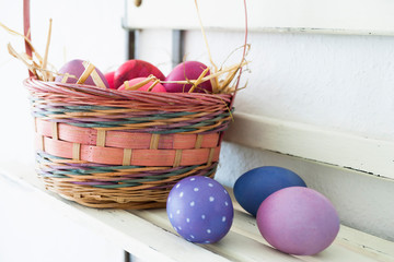 Easter eggs on a shelf in a basket