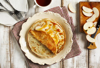 Crepes with apple and caramel sauce