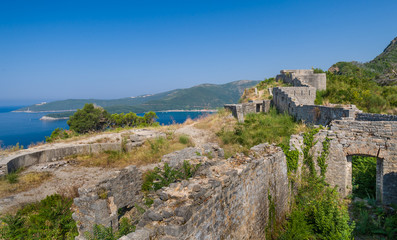 Fototapeta na wymiar Ancient fortress walls on the shore of Adriatic sea