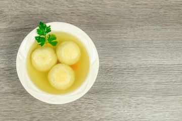 Matzah balls in a bowl of soup