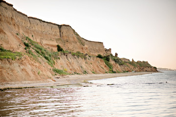 Fototapeta na wymiar Sand yellow hills near the sea coast