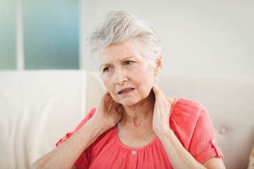 Senior woman suffering from neck pain