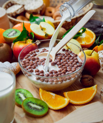 Beautiful breakfast. Milk,fruits, bread