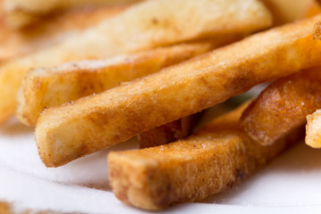 Close macro view of french fries on the plate