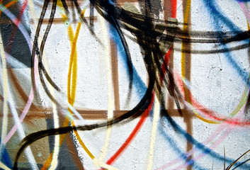 Random abstract spray painting graffiti wall colorful background. Random stroke line with spray. Rustic and grunge texture urban. Agitate, disturb and annoy. Close up.