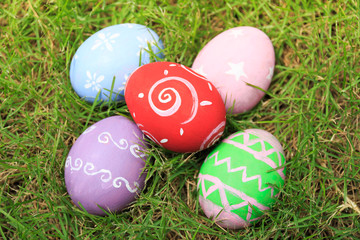 Top view of easter eggs on green grass